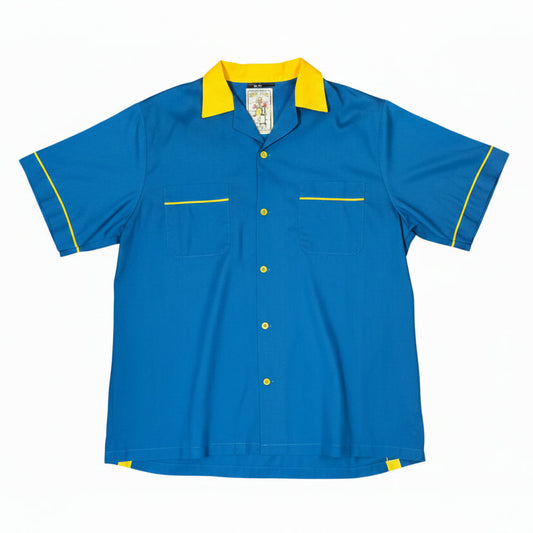 Camisa bowling vintage azul con detalles amarillos. Pieza original de estilo americano retro, perfecta para looks rockabilly, workwear y streetwear vintage. Disponible en Good Luck Vintage.Envíos a Canaria desde Las Palmas de Gran Canarias
